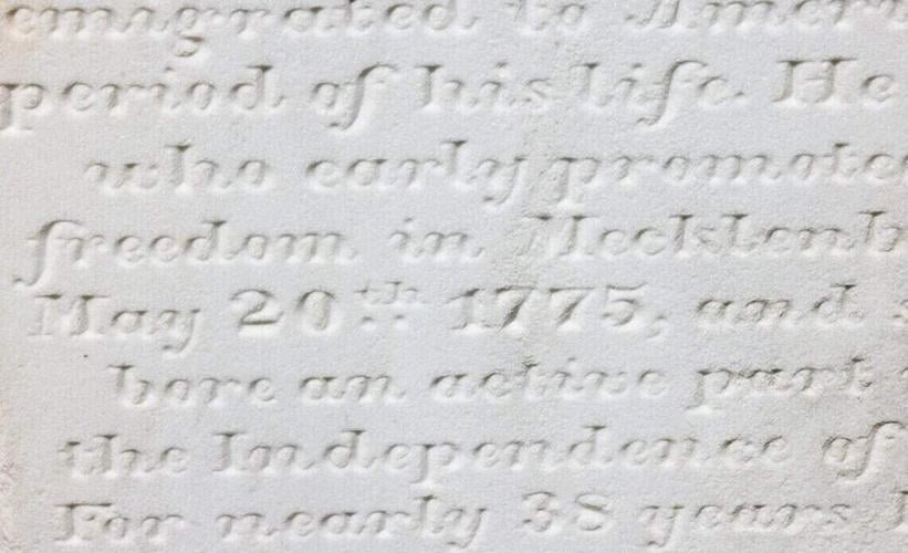 A tombstone details the life of a Revolutionary War soldier at the Steele Creek Presbyterian Church cemetery in Charlotte.