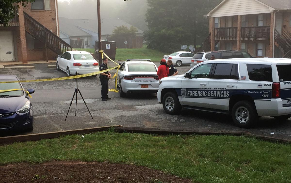 Basketball coach shot after answering his apartment door