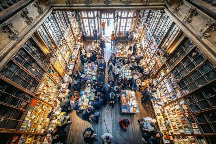 Porto, Portugal, Nov. 13, 2017, Customers and tourists in famous Lello Bookstore in Porto, considered to be one of the most beautiful bookstores in the world.