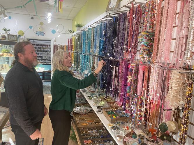 Reeders examining jewelry