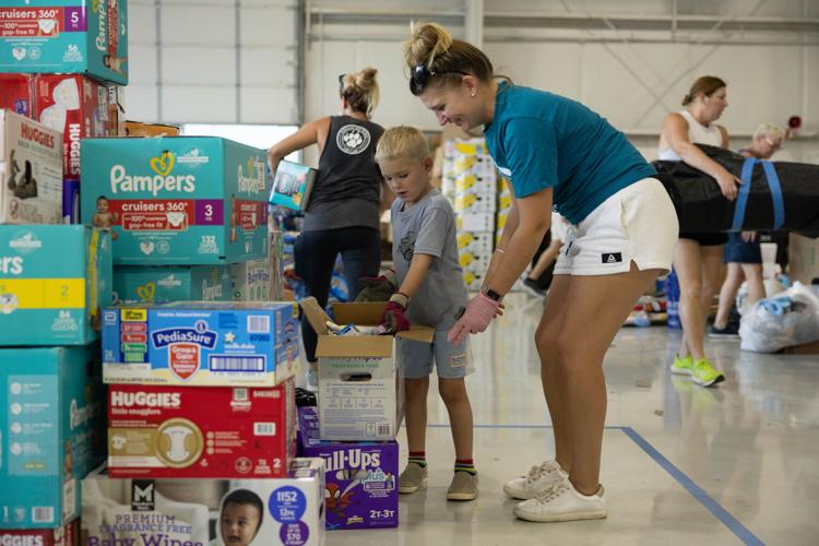 Woman and child helping