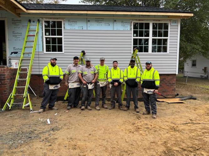 Kannapolis workers pitch to help at Habitat House