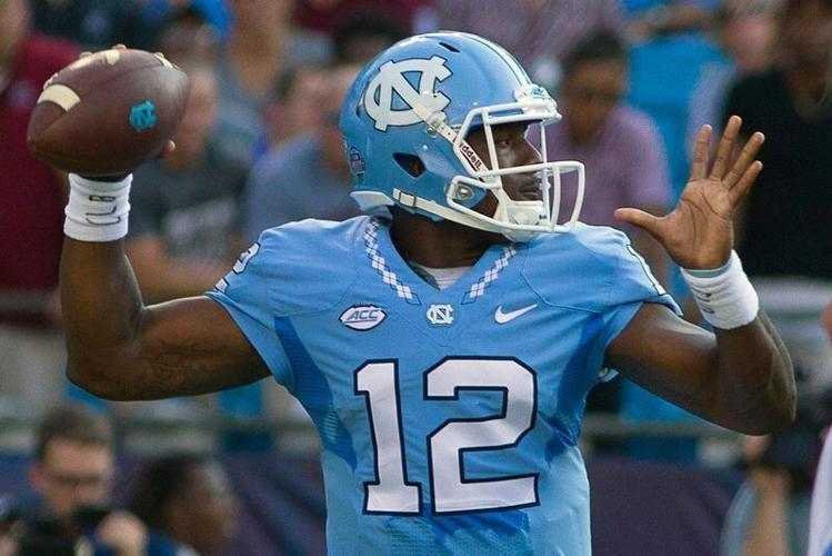Sep 3, 2015; Charlotte, NC, USA; North Carolina Tar Heels quarterback Marquise Williams (12) passes the ball during the first quarter against the South Carolina Gamecocks at Bank of America Stadium. Mandatory Credit: Joshua S. Kelly-USA TODAY Sports