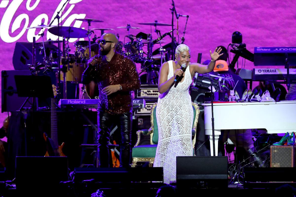 Radio host Kenny Burns and comedian Tiffany Haddish speak onstage during the 2022 Essence Festival of Culture at the Louisiana Superdome on July 2, 2022 in New Orleans.