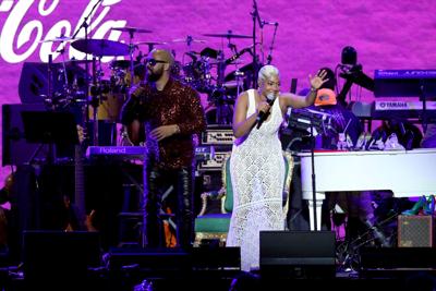 Radio host Kenny Burns and comedian Tiffany Haddish speak onstage during the 2022 Essence Festival of Culture at the Louisiana Superdome on July 2, 2022 in New Orleans.