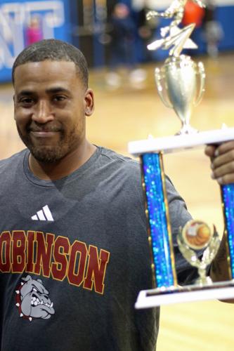 Bulldogs Coach Lavar Batts, Sr., Holds Up the Hardware