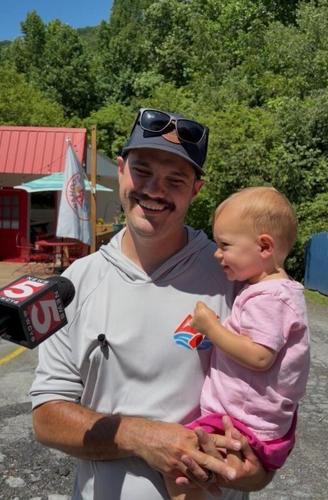 Slayton Johnson, co-owner of Wahoo's Adventures Nolichucky, speaks to the press outside the Wahoo's headquarters on June 12.