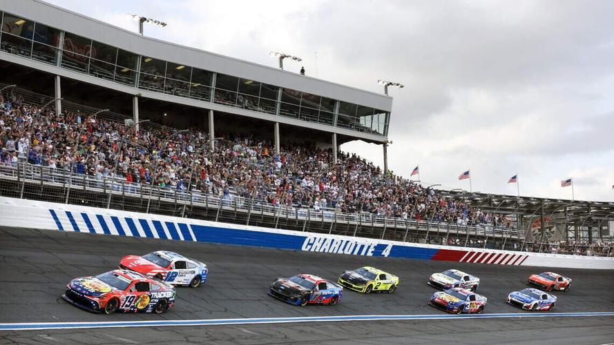 A portion of the field races at the Coca Cola 600 at turn four at Charlotte Motor Speedway Sunday, May 24, 2026.