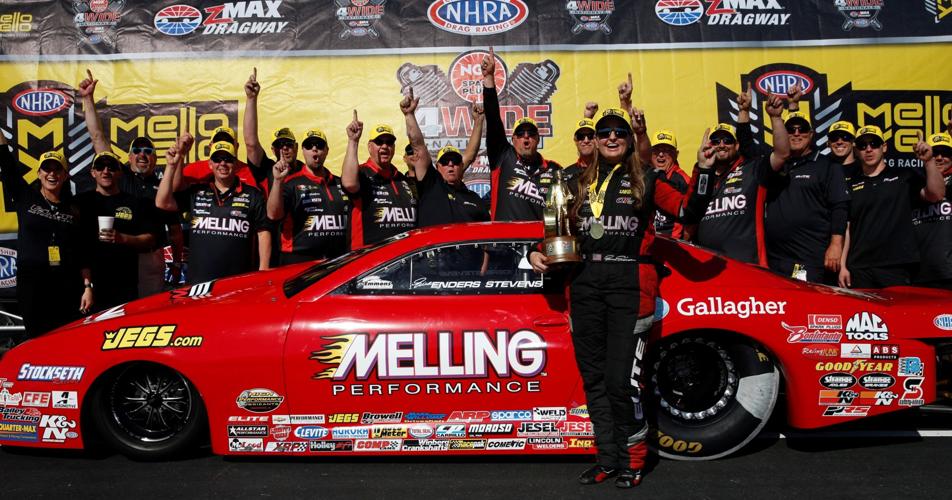 Pro Stock racer, Erica Enders-Stevens celebrates with her team in the winner circle after Sunday final eliminations of the 2018 NHRA 4-Wide Nationals at zMAX Dragway. Erica won the race with an elapsed time of 6.535 at 212.73 mph.
