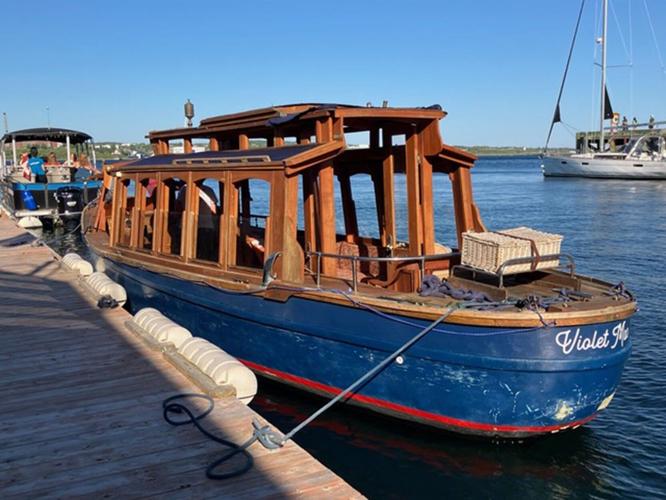 Having just flown in from Toronto for a week’ s visit, I was, in short order, seated next to seven sightseers, basking in the warmth of the weather and the charm of Violet Mae, an old wooden boat with a polished facade and a modern take on plying the wa...