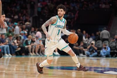 Apr 14, 2026; Charlotte, North Carolina, USA; Charlotte Hornets guard LaMelo Ball (1) moves the ball during the second half during the play-in rounds between the Charlotte Hornets and the Miami Heat of the 2026 NBA Playoffs at Spectrum Center. Mandatory Cr