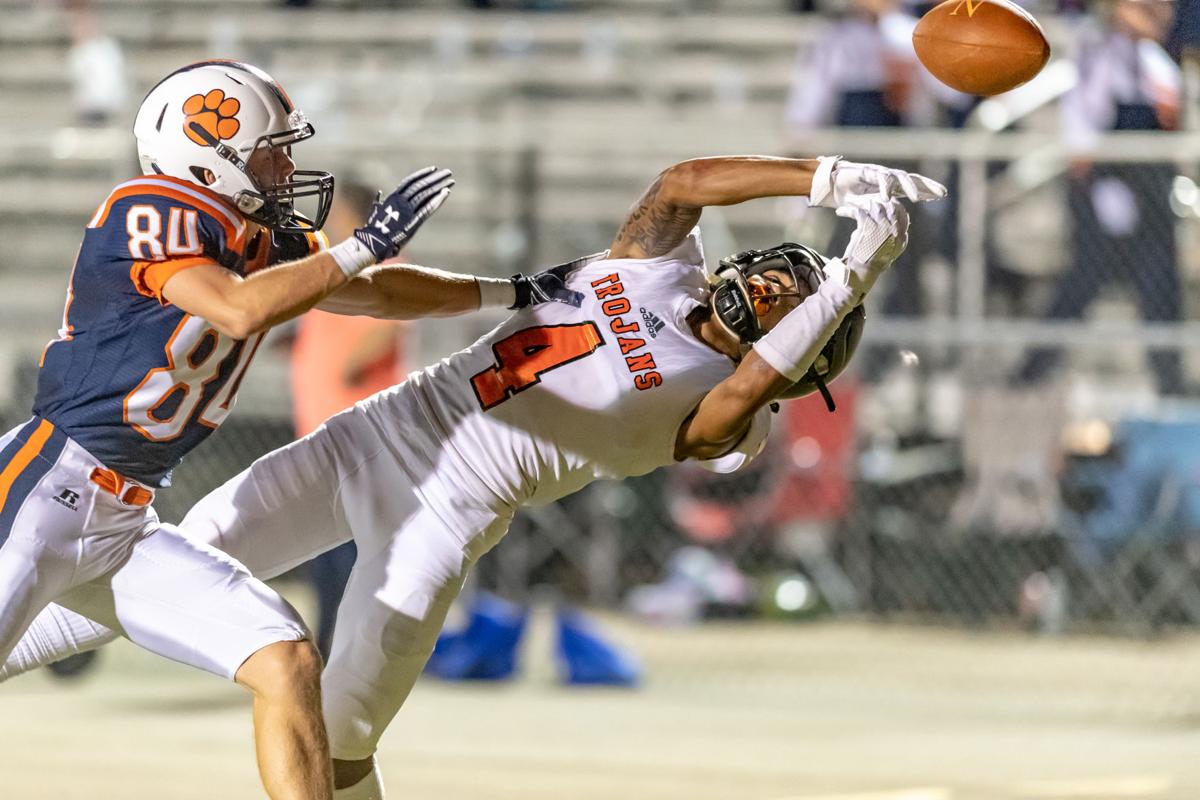 HIGH SCHOOL FOOTBALL: No. 1 Trojans step out of conference, stomp