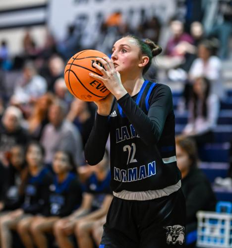 Lake Norman outscored Hickory Ridge 14-2 over the last four minutes to win 61-47.