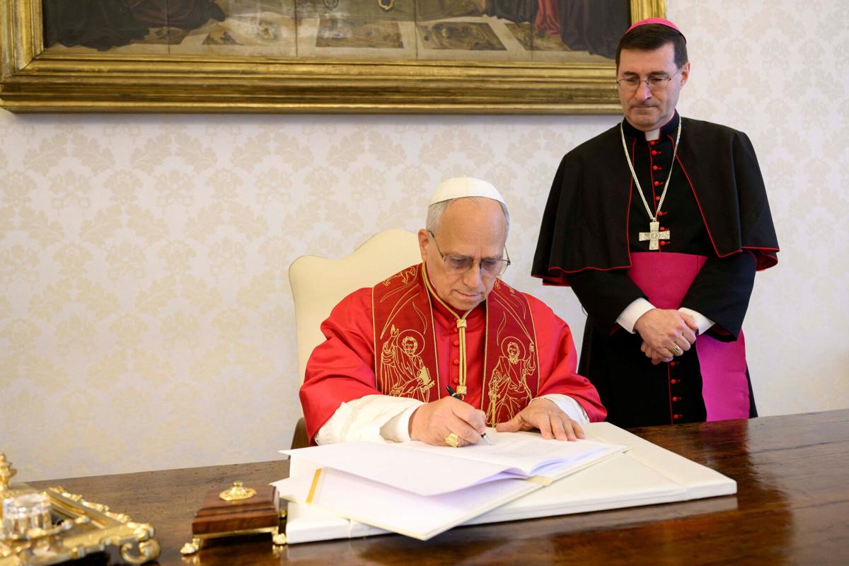 Pope Leo XIV signs "Magnifica humanitas" (Magnificent Humanity) at the Vatican, May 15, 2026.