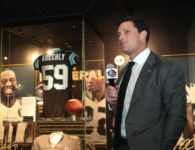 Luke Kuechly, a new Pro Football Hall of Famer, speaks about his items on display in a new exhibit at the Hall, Friday, April
