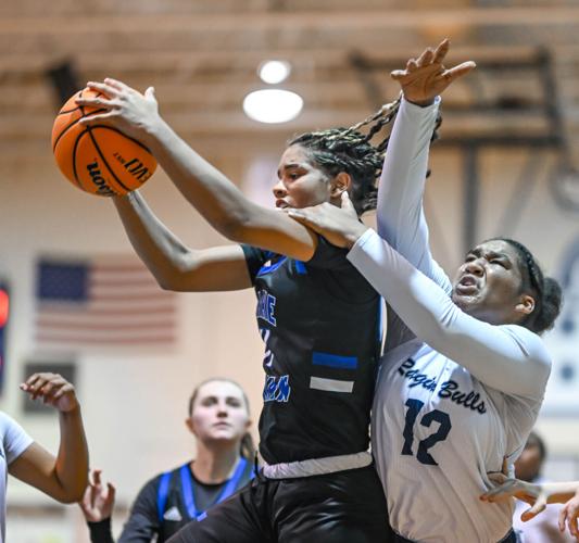 Lake Norman outscored Hickory Ridge 14-2 over the last four minutes to win 61-47.