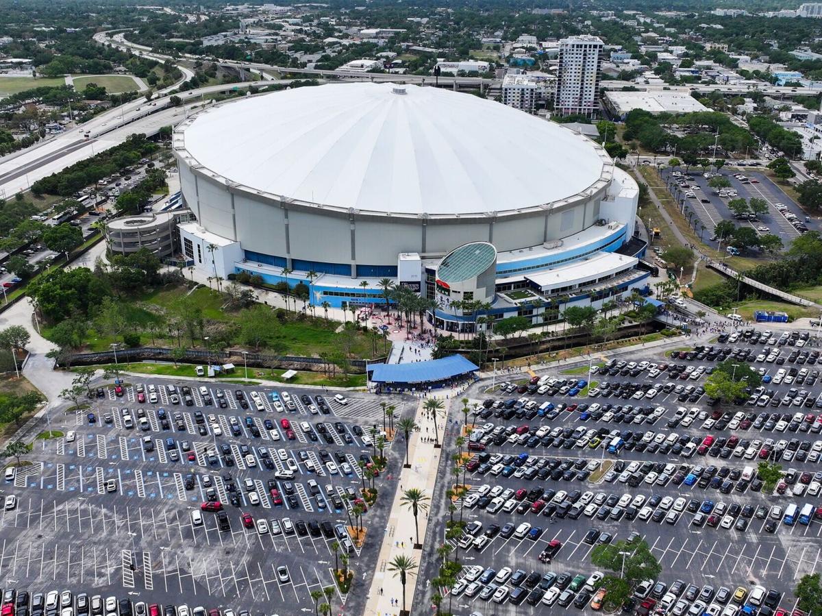 An aerial drone view of Tropicana Field as the parking lot fills up with vehicles and fans enter the stadium for the home opener in St. Petersburg, Fla..