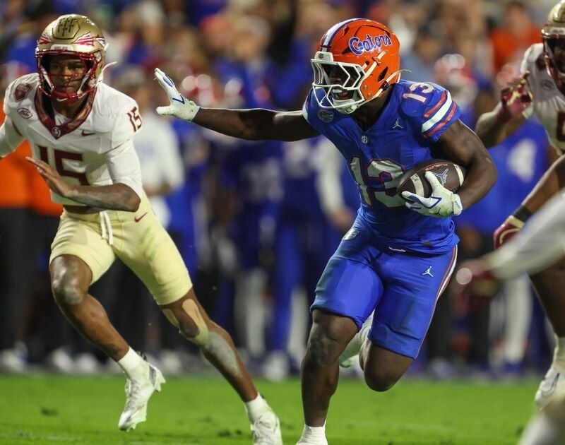 Florida running back Jadan Baugh (13) runs during the second half of an NCAA football game at Steve Spurrier Field at Ben Hill Griffin Stadium in Gainesville, FL on Saturday, November 29, Florida beat Florida State 40-21.2025. [Alan Youngblood/Gainesvil...