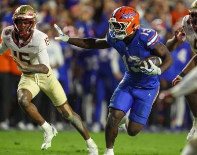 Florida running back Jadan Baugh (13) runs during the second half of an NCAA football game at Steve Spurrier Field at Ben Hill Griffin Stadium in Gainesville, FL on Saturday, November 29, Florida beat Florida State 40-21.2025. [Alan Youngblood/Gainesvil...