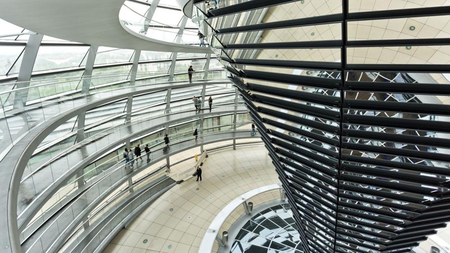 As you climb the dome of the Reichstag, you circle a cone of mirrors that point down, directing your vision toward where legislators gather.