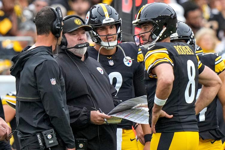 Pittsburgh Steelers quarterback Aaron Rodgers (8) checks with head coach Mike McCarthy after calling a timeout in the fourth