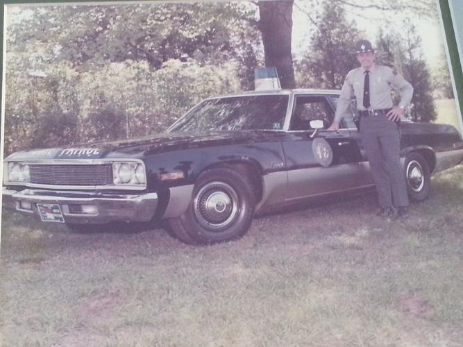 Young Jack with patrol car