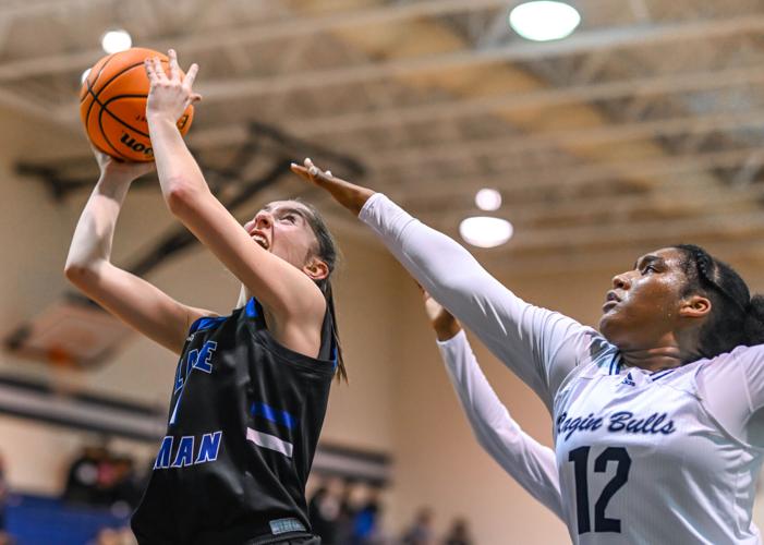 Lake Norman outscored Hickory Ridge 14-2 over the last four minutes to win 61-47.