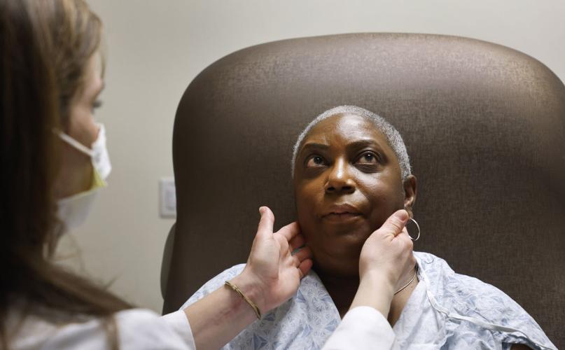 Nurse Practitioner Rachel Roberts examines Stephanie Walker of Tarboro during an appointment at the Duke Cancer Clinic in Durham, North Carolina, Thursday, Feb. 2, 2023.