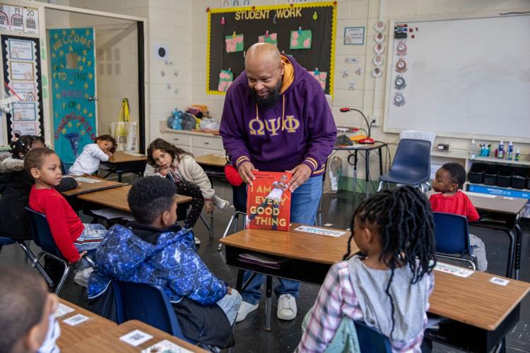 Terrence Howley reads to students