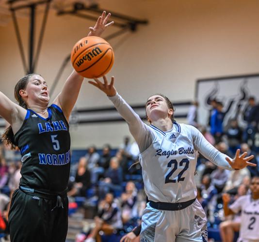 Lake Norman outscored Hickory Ridge 14-2 over the last four minutes to win 61-47.