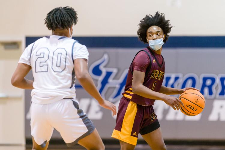 Boys Basketball: The Boys Jay M. Robinson Bulldogs defeated the Hickory Ridge RaginÕ Bulls 72-69 on Thursday night.