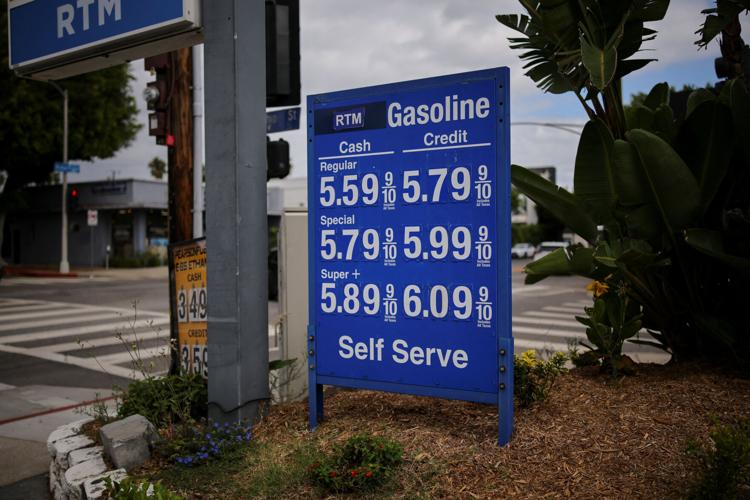 Gas prices are listed at a service station in Los Angeles