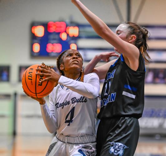 Lake Norman outscored Hickory Ridge 14-2 over the last four minutes to win 61-47.
