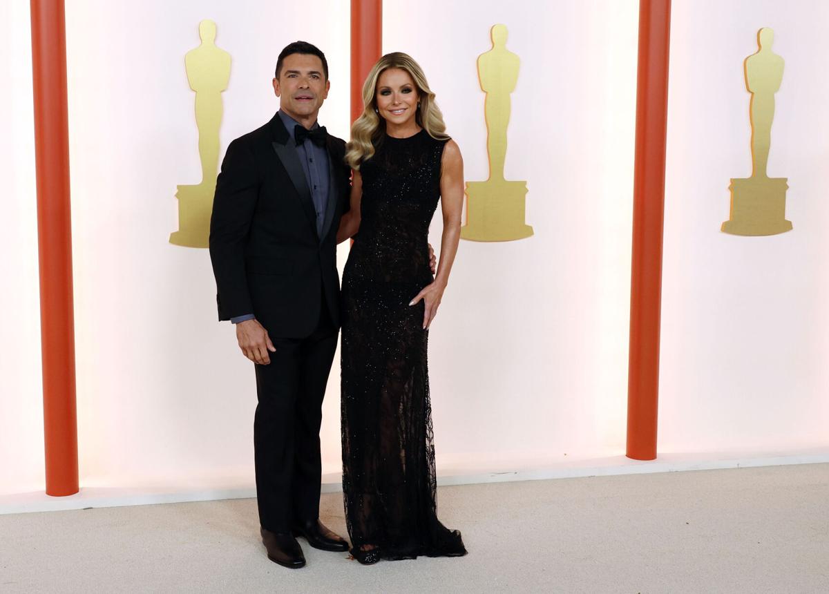 Mark Consuelos, left, and Kelly Ripa attend the 95th Academy Awards at the Dolby Theatre on March 12, 2023, in Hollywood, California.