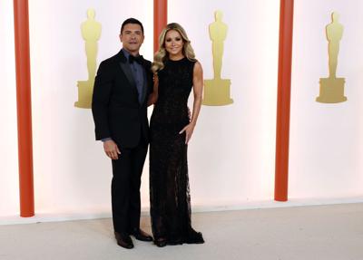 Mark Consuelos, left, and Kelly Ripa attend the 95th Academy Awards at the Dolby Theatre on March 12, 2023, in Hollywood, California.