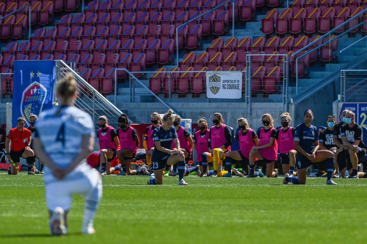 Players from the North Carolina Courage and Portland Thorns FC knee out of respect for the Black Lives Matter movement during the first round of the NWSL Challenge Cup at Zions Bank Stadium in Herriman, Utah, on Saturday, June 27, 2020.