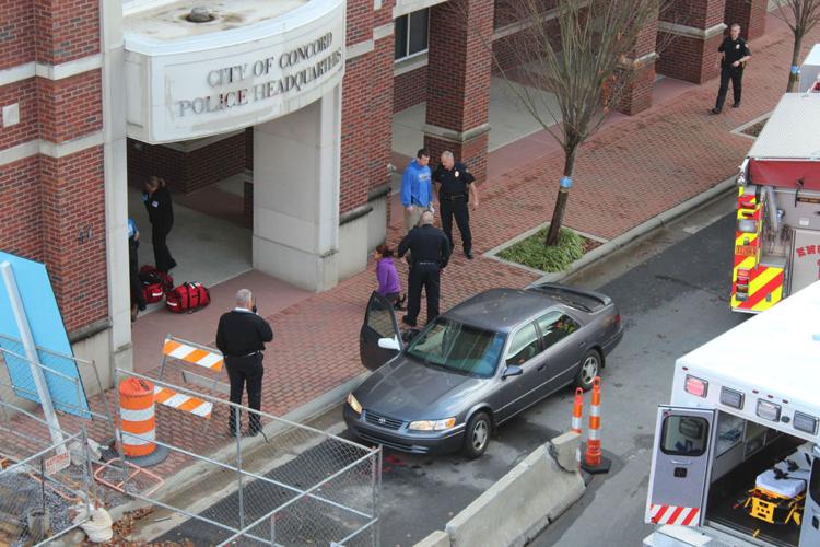 Picture of police officer,EMS, and WWE staff desperately working