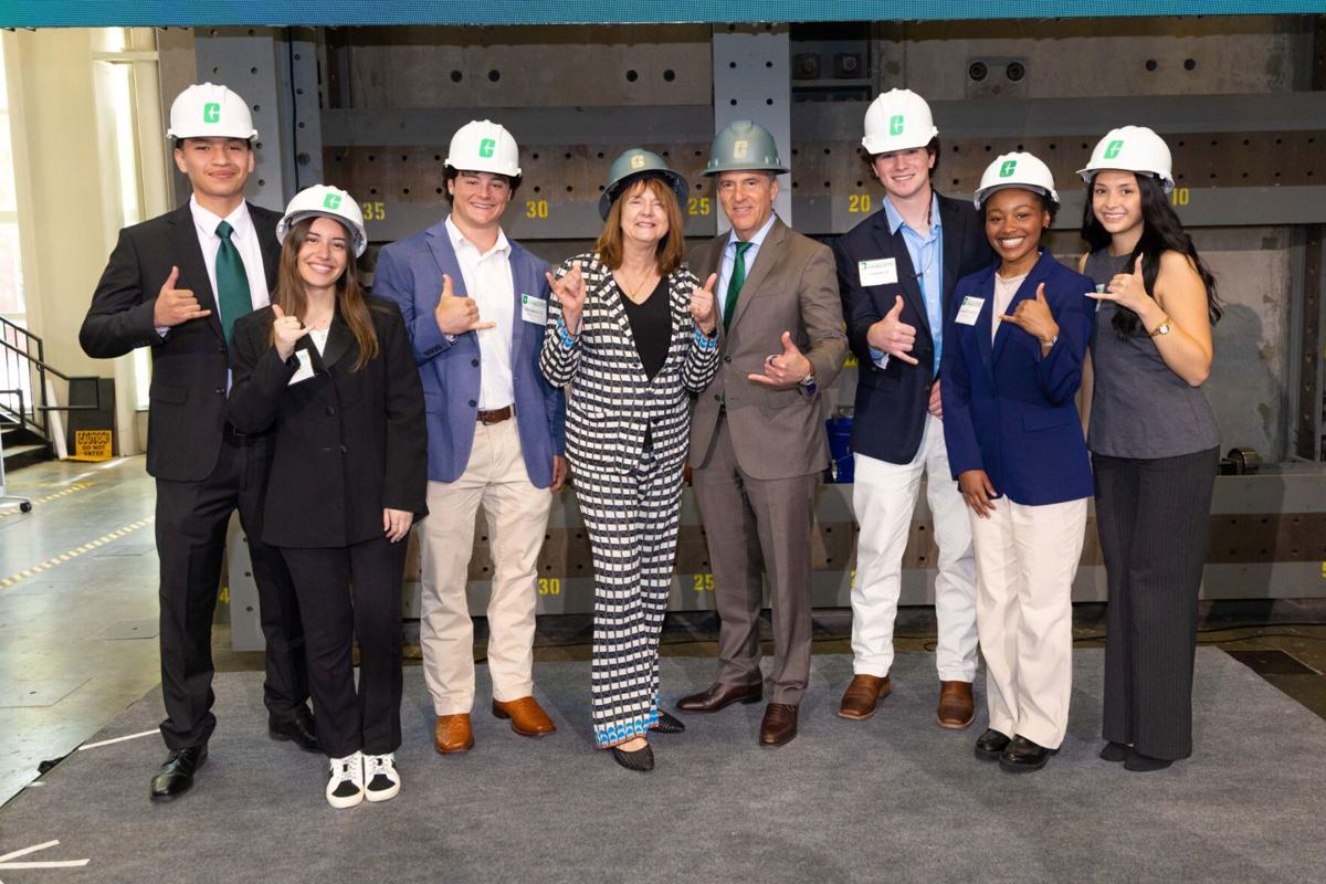 Darla and Craig Albert with students