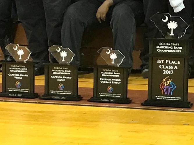 Six marching band defends state championship News