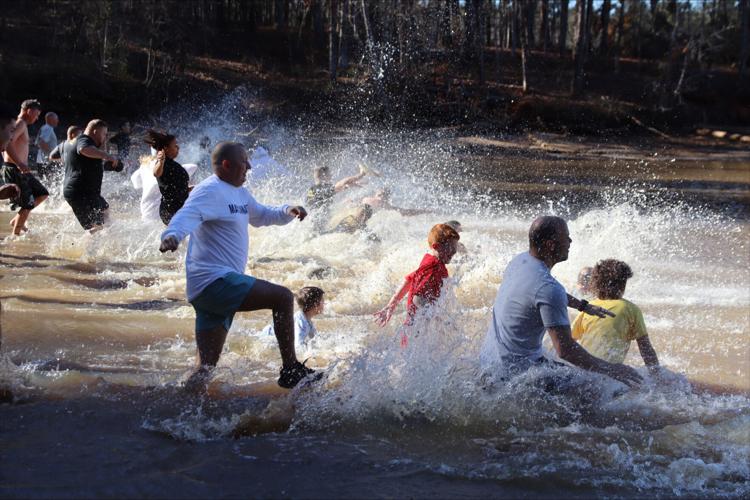 Polar plunge participants around the world kick off 2022 with an