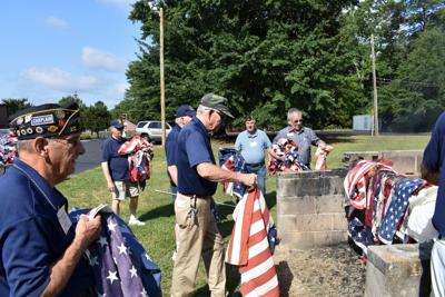American Legion members conduct flag disposal ceremony