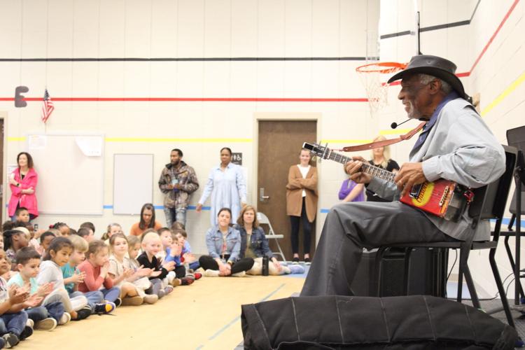South Carolina blues artist Mac Arnold plays for students at Mays Elementary in February