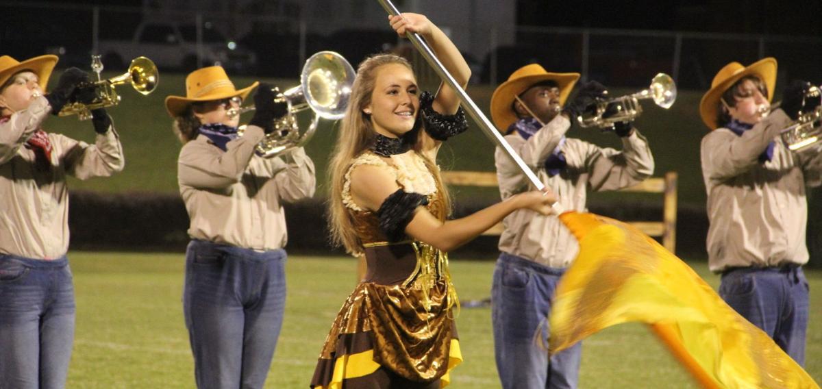 Six marching band defends state championship News