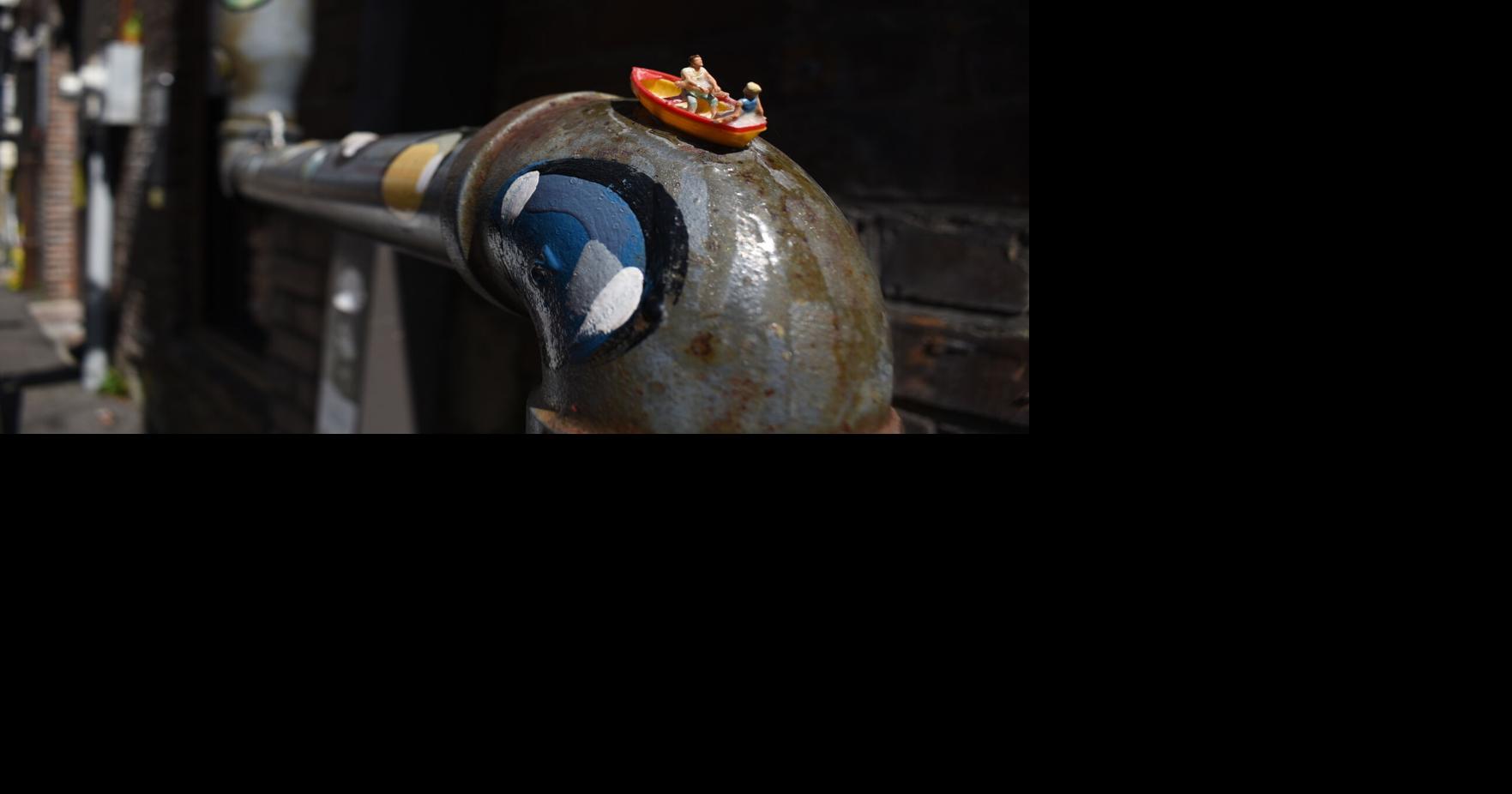 Miniature art transforms an alley into a surrealist wonderland at...