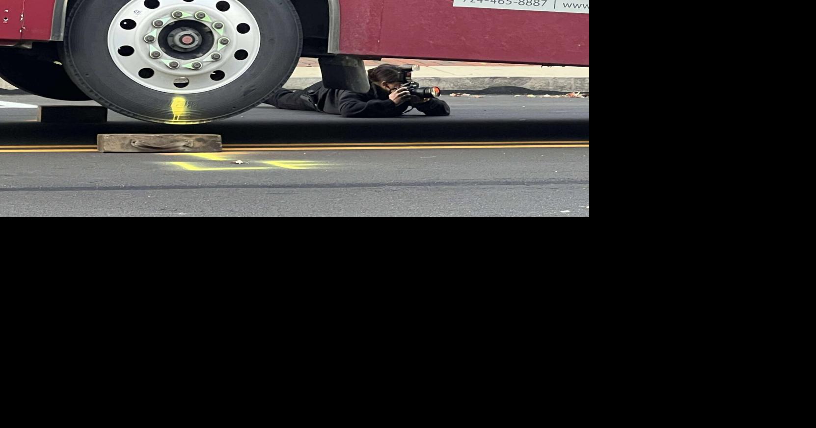 fatal accident philadelphia street investigator photographing bus.jpg