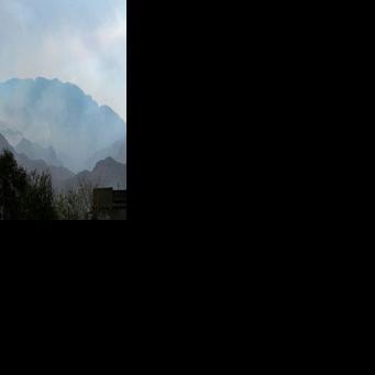 Smoke billows after Pakistani air strikes near an Afghan military base at the border between Afghanistan and Pakistan