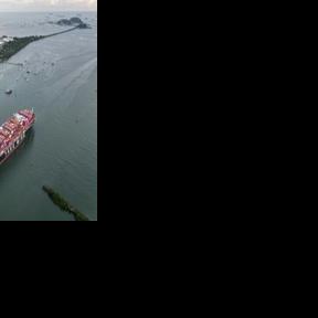 A Taiwanese cargo ship sails out of the Panama Canal on the Pacific side