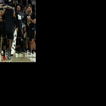 Jimmy Butler is helped off the court by Golden State team-mates after suffering a season-ending knee injury