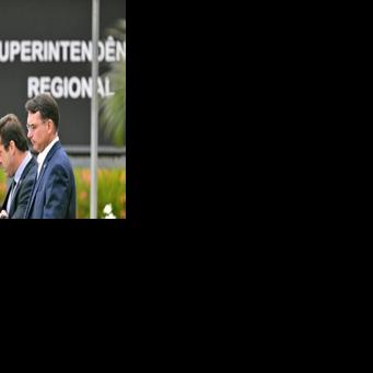 Senator Flavio Bolsonaro (R), son of former Brazilian president Jair Bolsonaro, leaves the Federal Police headquarters in Brasilia where his father is being held