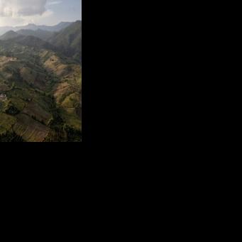 The mountains surrounding Muang Na village, with Myanmar in the distance, in Chiang Mai province